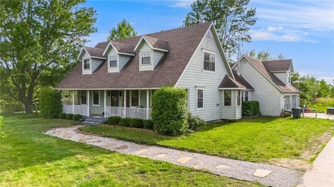 Hillside home near Flint Creek Power Plant lake in Gentry
